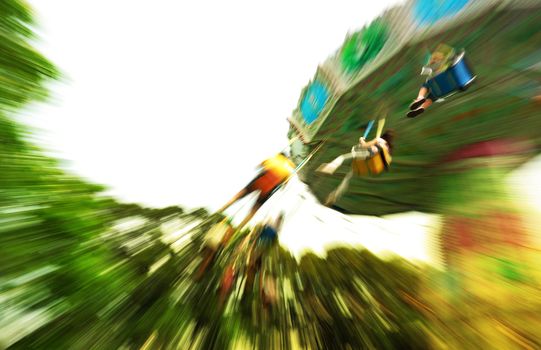 fun in theme park abstract motion blur