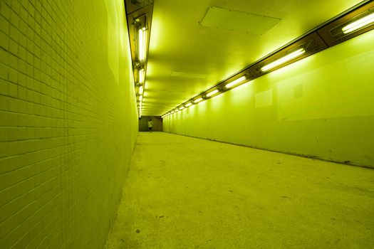 long tunnel with lamps and nobody walking