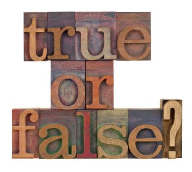 True or false question in vintage letterpress type blocks stained by color inks , isolated on white