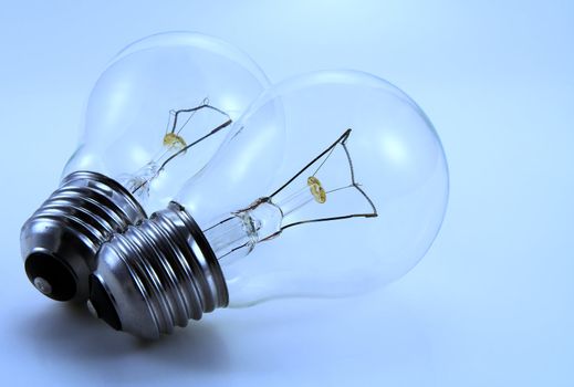 Two electric bulbs. Blue tinted image