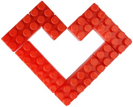 Red heart combined from details of the meccano on a white background