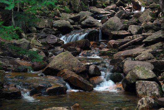 Picture of a natural small water fall in summer