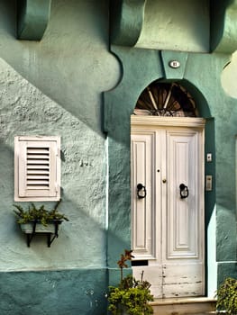 Typical features on a facade of a house in Malta 