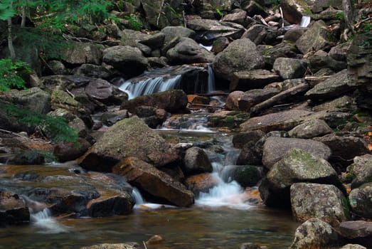 Picture of a natural small water fall in summer