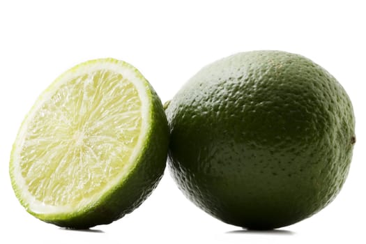 one lime and a half lime on white background