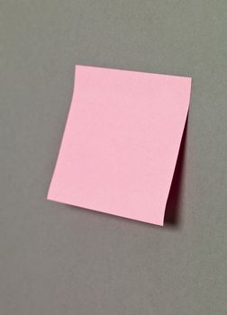 Pink Adhesive Note on grey background