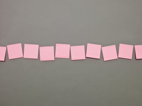 Pink Adhesive Notes in a row