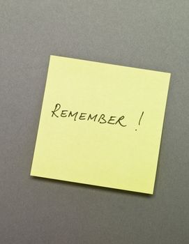 Adhesive Note with "Remember" wrote on it
