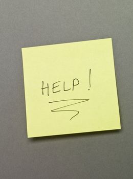 Adhesive Note with "Help" wrote on it