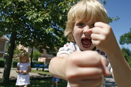 angry kid trying to smash up camera