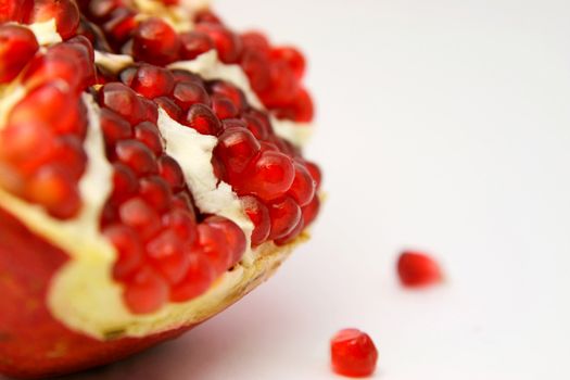 colorful picture of juicy pomegranate on white background