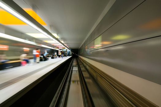 motion blurred shot of train station while moving