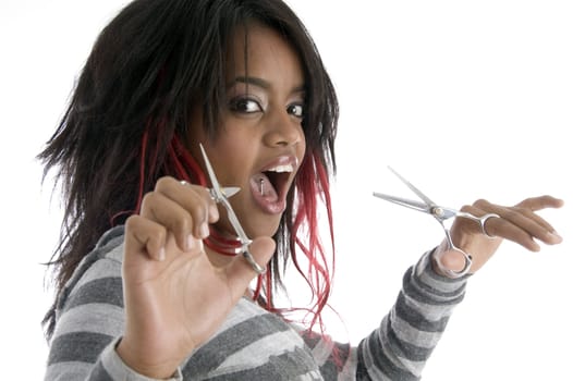 african female with scissors on an isolated white background