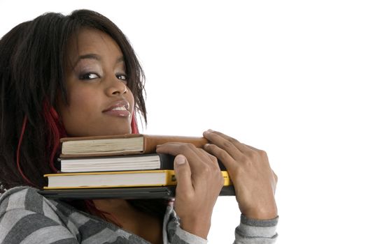 girl keeping her chin on books on an isolated white background