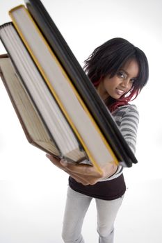 girl showing books against white background
