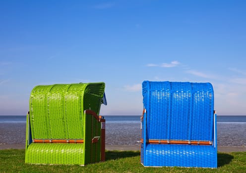 This image shows two beach chairs