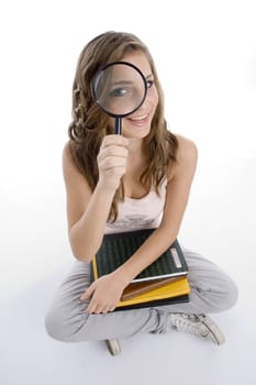 happy girl with books and lens on an isolated white background