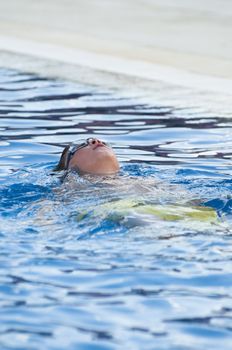 Picture of a boy on a swimming pool