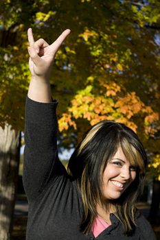 A young woman rocking out in a new england setting during autumn.