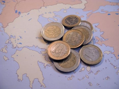 Coins on map Greece