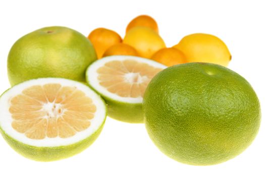  Big green grapefruits,lemon and mandarines close-up on white background