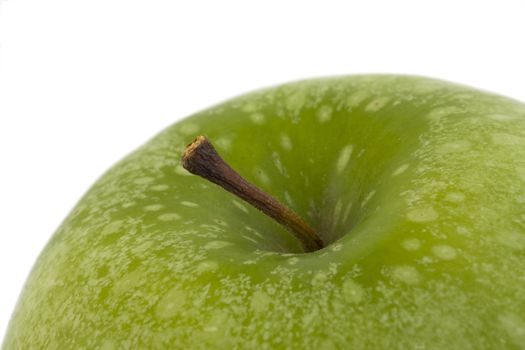 detail of a granny smith apple isolated on white background