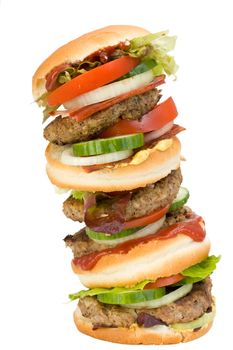 a home made quadruple hamburger isolated on white background