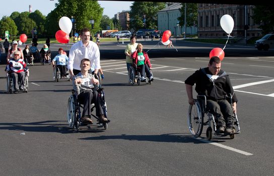 RIGA, LATVIA - MAY 23: Disabled people participate in the Riga International Marathon in May 23, 2010, Riga.