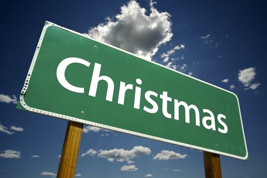 Christmas Road Sign with dramatic clouds and sky.