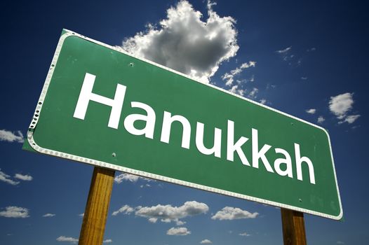 Hanukkah Road Sign with dramatic clouds and sky.