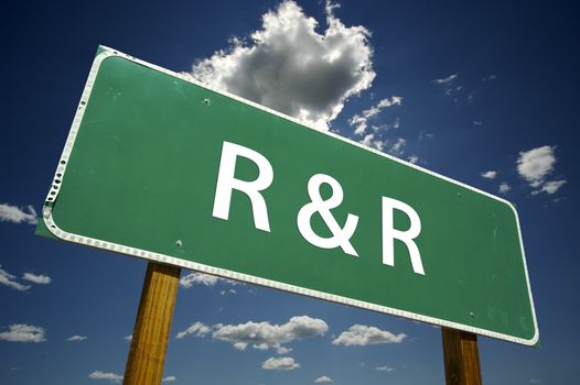 R and R Road Sign with dramatic clouds and sky.