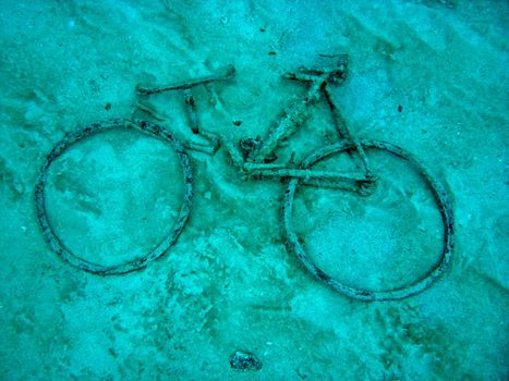 Old bicycle lying near a shipwreck