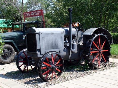 Blue old tractor at the outdoor technique museum