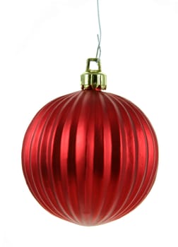 A single isolated red Christmas bauble hanging.
