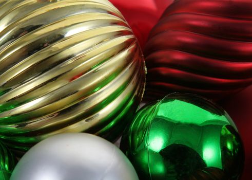 A closeup of a bunch of Christmas baubles.
