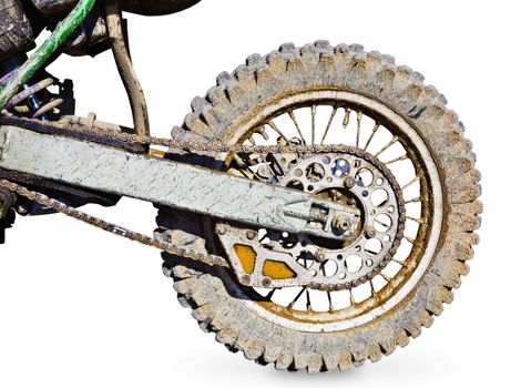 Rear wheel motorcycle for trial covered with mud isolated on white background