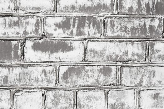 Wall from a grey brick damaged by a mould