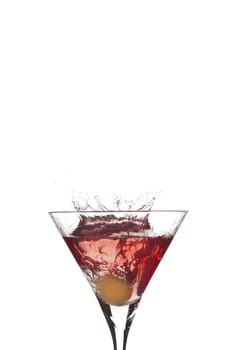 Cocktail splash with crown from olive on red martini with white background