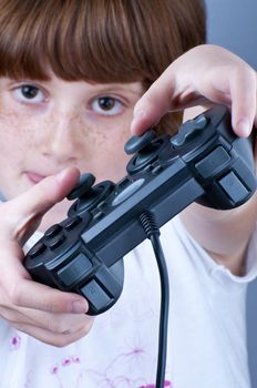 Picture of a young with freckles playing games.