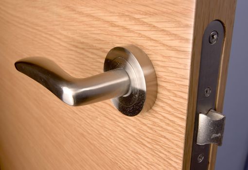 locked wood door and lock handle inside a house as a background