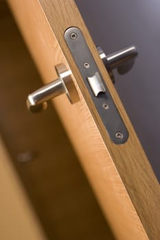 locked wood door and lock handle inside a house as a background