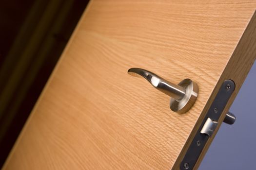 locked wood door and lock handle inside a house as a background