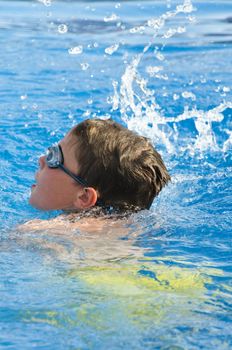 Picture of a boy on a swimming pool