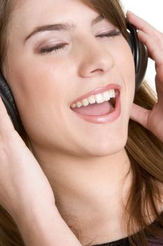 Singing girl wearing music headphones