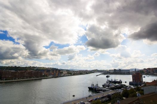 Stuary of Bilbao, Las Arenas Getxo and Portugalete with a beautiful cloudy sky