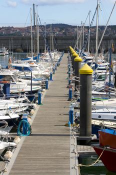 boat resting in paceful water in the dock harbor of Santurce near Bilbao