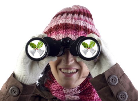 christmas woman holding and looking through binoculars