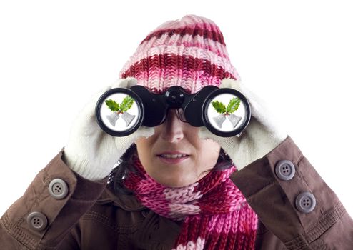 christmas woman holding and looking through binoculars