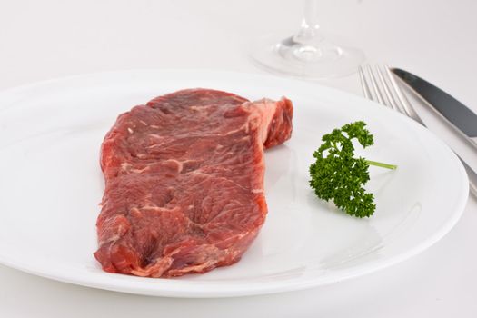 raw steak on a plate