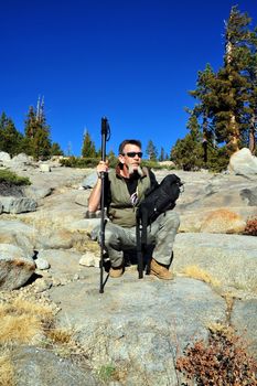 A single male day hiker taking a rest break while hiking in the California Sierra's